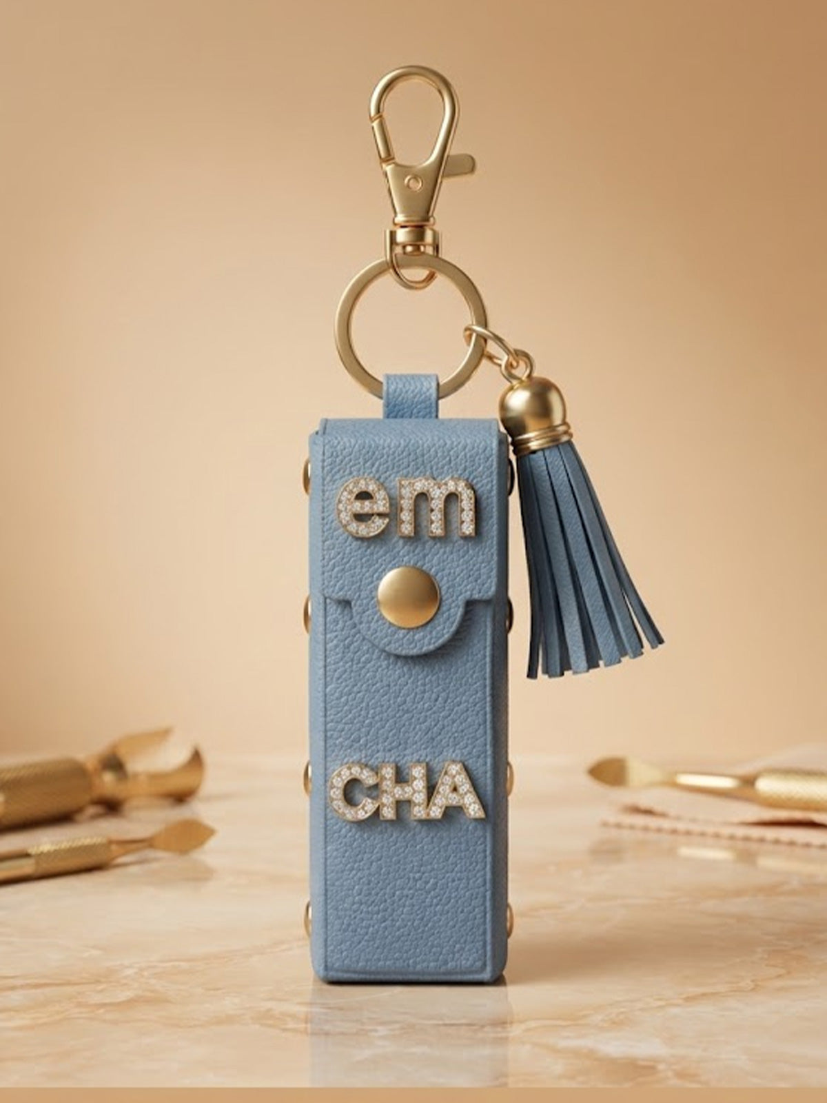 White mini wallet with gold tone studs and tassel Keychain | KCIN240