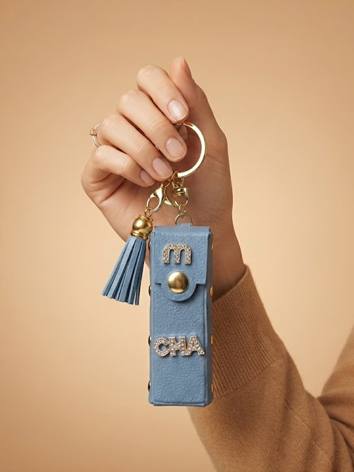 White mini wallet with gold tone studs and tassel Keychain | KCIN240
