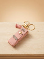 White mini wallet with tassel and gold tone accents Keychain | KCIN250