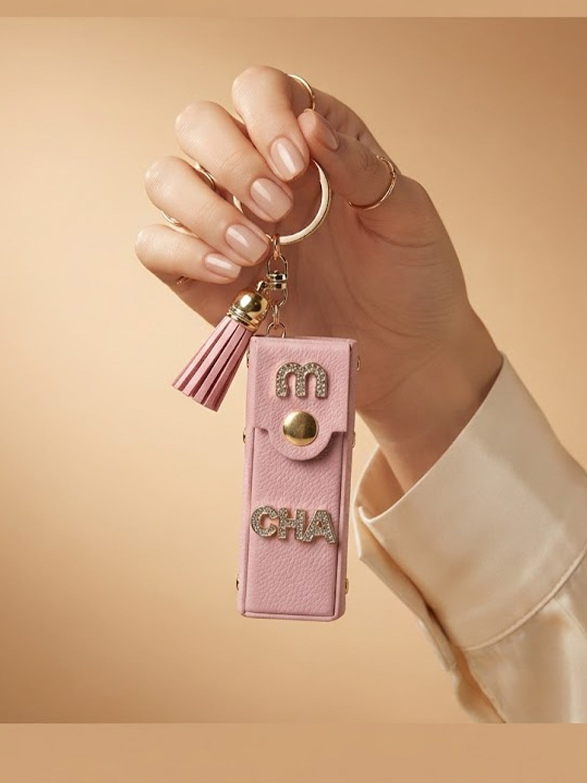 White mini wallet with tassel and gold tone accents Keychain | KCIN250
