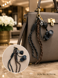 Black novelty figure charm with braided cords Keychain | KCIN136