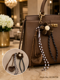 Brown flower pom charm with braided cords Keychain | KCIN138