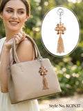 Amber flower with gold tone hanging strands Keychain | KCIN37