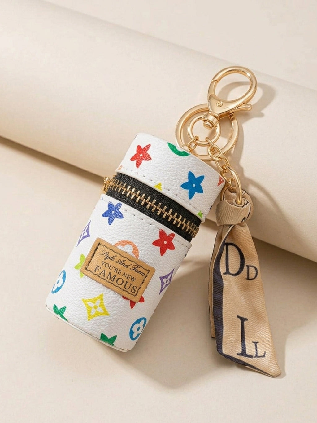 White cylindrical mini pouch with colorful star pattern Keychain | KCIN152
