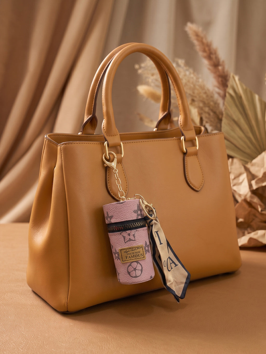 Pink cylindrical mini pouch with star pattern and scarf tail Keychain | KCIN159
